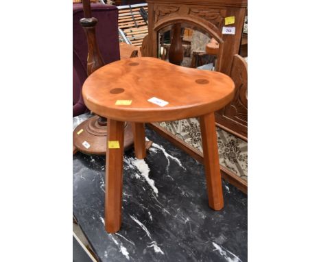 A kidney shaped stool, craftsman made, similar to mouseman but sadly no mouse on this one