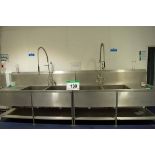 Two Stainless Steel Twin Pot Wash Sinks, each with Overhead Shower Lance (NOTE: Needs a Method