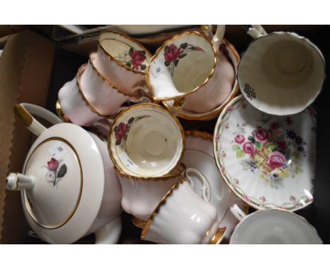 A Royal Imperial part tea service in pink having gilt edging and rose design (21 pieces approx) etc.