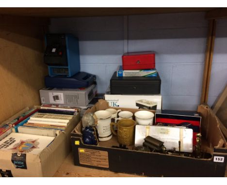 A shelf of assorted, to include lockboxes and books etc.