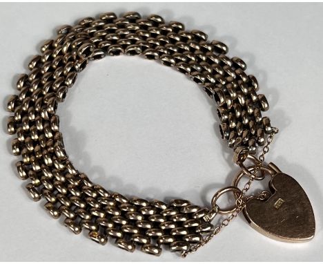 A yellow metal gate bracelet stamped '9ct', 22.5gm 