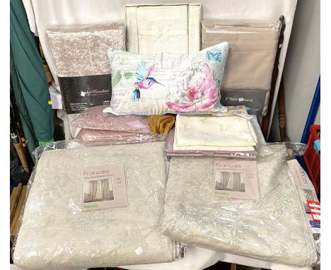 A selection of linen, unopened curtains etc 