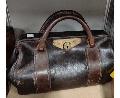 A vintage Rent Collector's leather bag with locking clasp and key. 