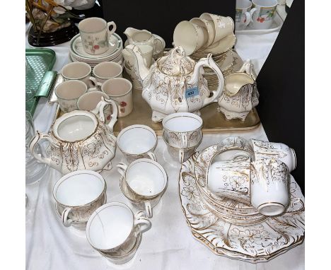 A Wedgewood Raspberry Cane part tea service another similar Continental part tea service and Poole tea ware etc 