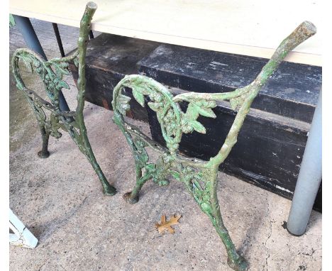 A Victorian pair of cast iron ends for a garden bench 