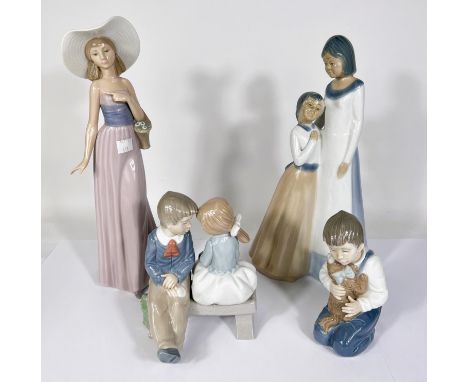 Two Nao figures:&nbsp; girl in hat, height 32cm &amp; boy with puppy; a group:&nbsp; kissing; a similar unmarked group:&nbsp;
