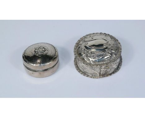 A hallmarked silver circular pill box, embossed decoration, Birmingham 1894; a floral embossed patch box, import marks 