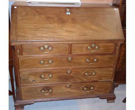 A mid Georgian mahogany fall front bureau with fall front and fitted interior, 3 long and 2 short graduating drawers with bra