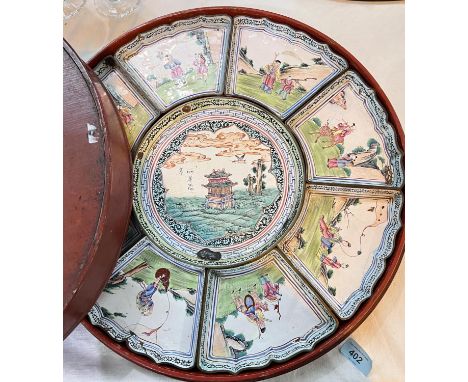 A 19th century Chinese Canton enamel decorated hors d'oeuvres dish, circular central section with 8 surrounding panels contai