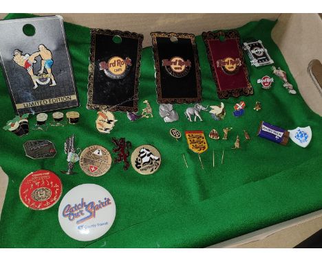 A selection of Hard Rock Cafe badges including limited edition; a vintage 3 dimensional Blue Peter badge, Guiness etc. 