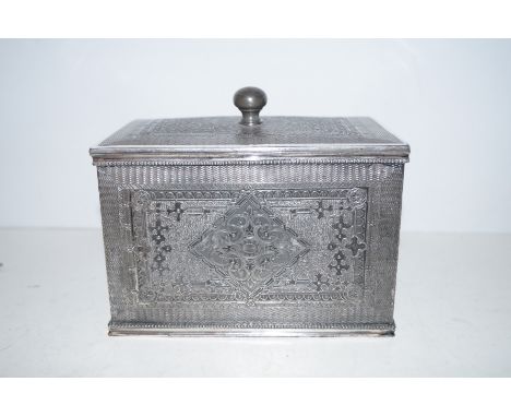 A Victorian silver plated tea caddy with Persian style decoration, he hinted velvet lined lid enclosing two lidded compartmen