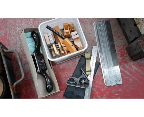 A collection of tools to include Stanley plane, miniature wooden planes & rulers etc 