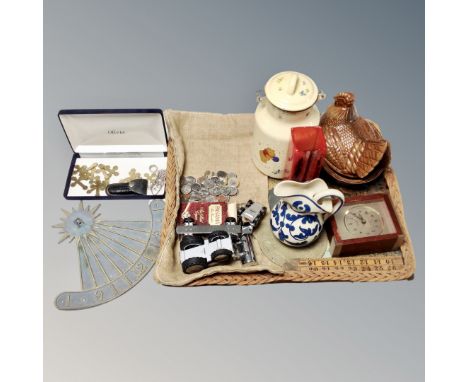 A wicker tray containing miniature brass crosses, boxwood ruler, metal sundial, assorted coins, studio glass vase etc 