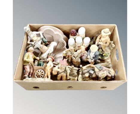 A box of assorted Continental figurines, ceramic clam shell wall sconce 