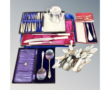 A tray of plated tea pot, boxed and unboxed cutlery, servers, silver handled shoe horn and button hook in case 