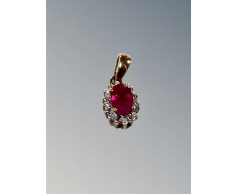 A ruby and diamond silver pendant 