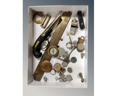 A box of assorted coins, pocket knives, WW II medal, pocket compass in treen pot, brass slide rule, Scots Guard belt buckle, 