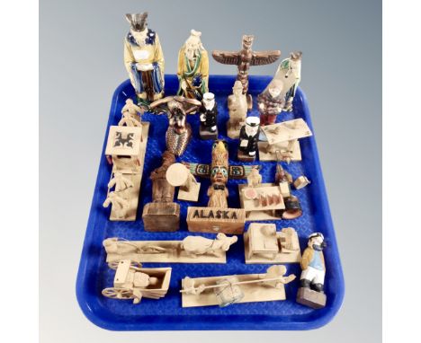 A tray of wooden and ceramic tourist carvings and figures 