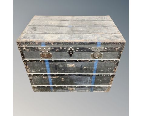 An antique metal bound shipping trunk 