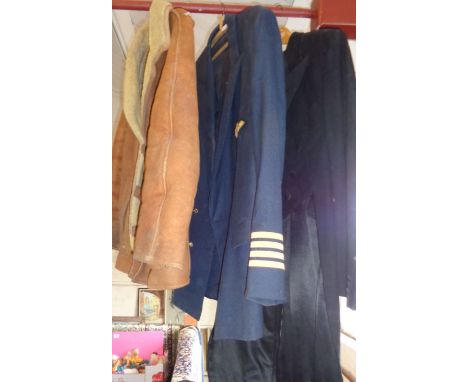 Vintage clothing: A British Caledonian pilot's tunic, a gent's tailcoat and a sheepskin jacket