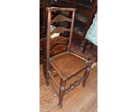 19th c. ash and elm ladder back side chair with solid seat above turned legs with pad feet