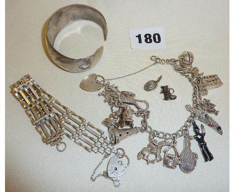 Vintage silver charm bracelet with many charms, hallmarked silver gate bracelet and a silver bangle
