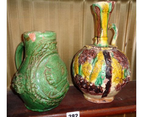 Ottoman Chanakkale polychrome pottery ewer, 27cms and an unusual later green glazed similar with portrait mask of Ataturk 