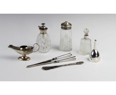 A selection of silver and white metal tableware and accessories, to include a silver table lighter in the form of a genie's l