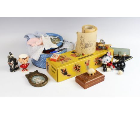 A selection of doll's clothing, toys and vintage ephemera, to include a Pelham cat puppet, a roll of Izal type toilet paper, 