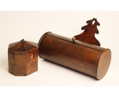 A George III yew wood tea caddy, of octagonal form, the hinged segmented cover opening to an enclosed lid, 13cm high (at faul