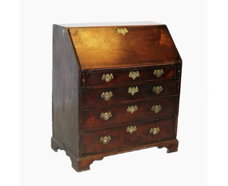 A mid George III mahogany bureau, the cross banded fall front opening to a waterfall interior punctuated with pilasters, abov