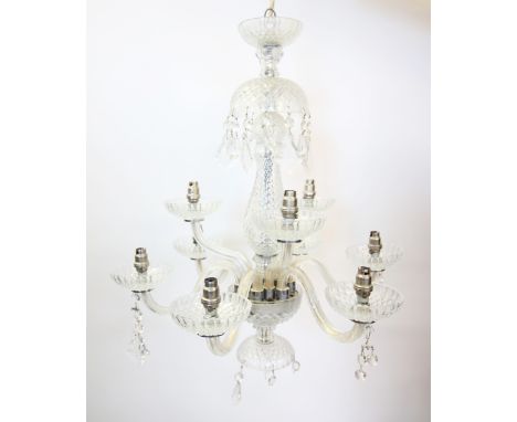 An early 20th century eight branch glass chandelier, the baluster shaped stem extending to eight 'S' shaped arms, 60cm high L