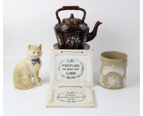 A bargeware treacle glazed teapot, cover and stand in the Measham manner, decorated with applied relief moulded floral motifs