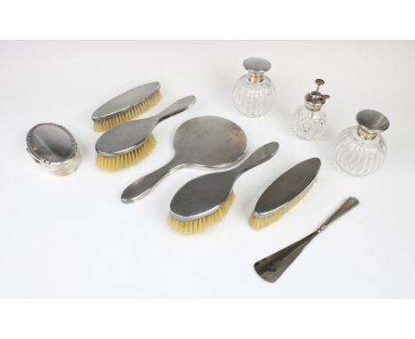 An Art Deco Britannia standard silver backed dressing table set by British Metallising Co Ltd, London 1928-9, comprising hand