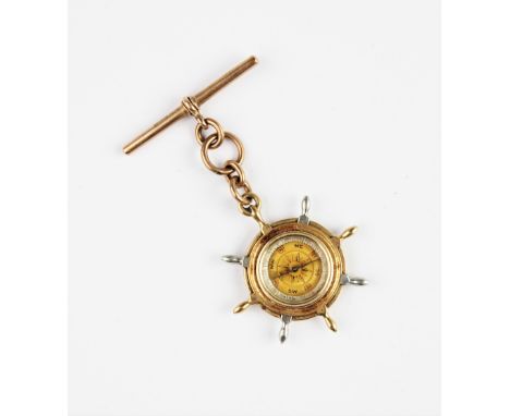 A Victorian 15ct gold fob compass in the form of a ship's wheel, the reverse decorated with enamel maritime signal flags, 37m