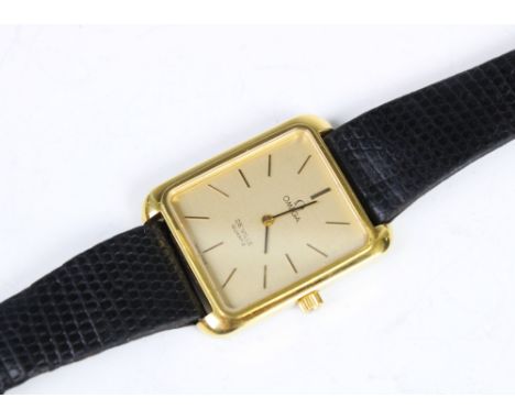An 'Omega De Ville' stainless steel quartz wristwatch, the rectangular gold toned dial with baton markers, set to a plain pol