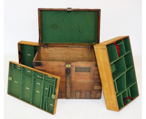 A 19th century oak and metal bound silver chest, applied with iron side swing handles and corner brackets, opening to an arra