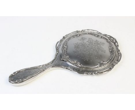 An Edwardian silver backed mirror by Henry Matthews, Birmingham 1905, engraved with butterflies, flowers and foliate decorati