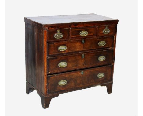An early 19th century mahogany chest of drawers, with an arrangement of three short over three graduated long drawers, applie