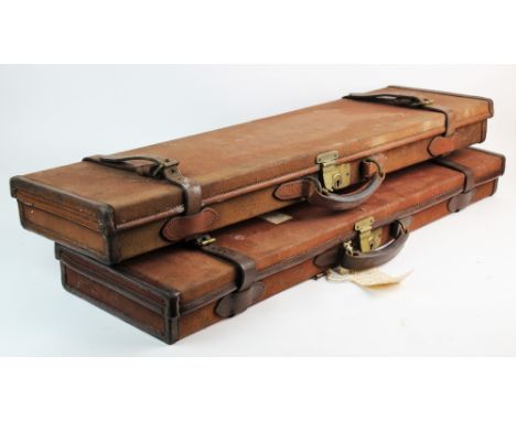 Two vintage gun cases by William Evans Ltd, 67A St James Street, London, SW1, each of rectangular form, canvas and leather bo