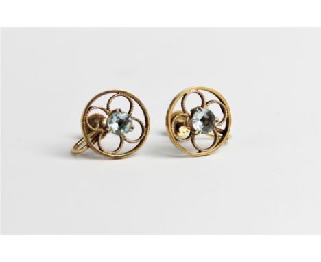 A pair of zircon set 9ct gold earrings, each comprising a central round mixed cut light blue zircon measuring 5mm diameter, c