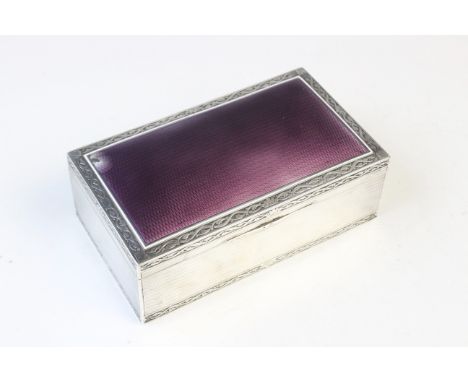 A French silver and enamel cigarette box by Paul Guillon, of rectangular form, purple enamel to engine turned cover, scrollin