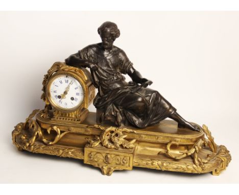 A late 19th century French gilt metal and spelter mantel clock, surmounted with a spelter Classical figure, opposing a 10cm w