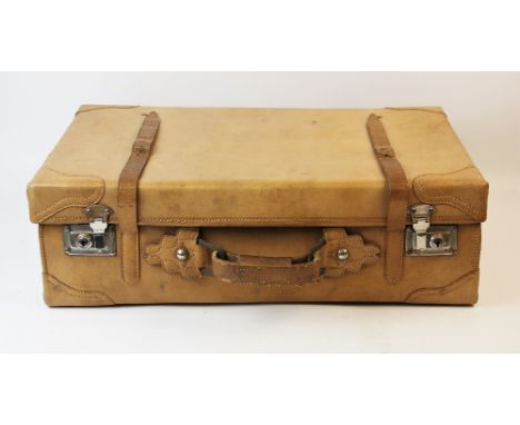 A vintage pig skin suitcase and fitted dustcover, 20th century, the suitcase with reinforced corners, twin locks and over-str