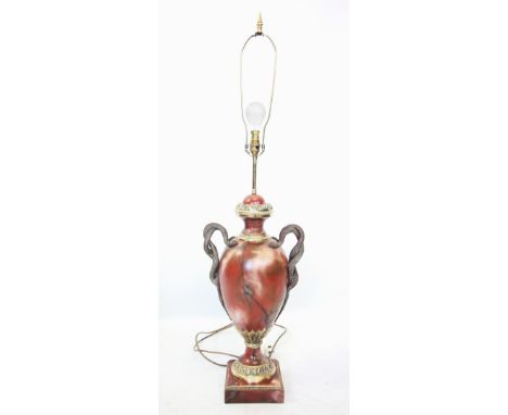 A rouge marble effect lamp base, modelled as a two handled pedestal urn, with snake twist handles, 112cm high including shade