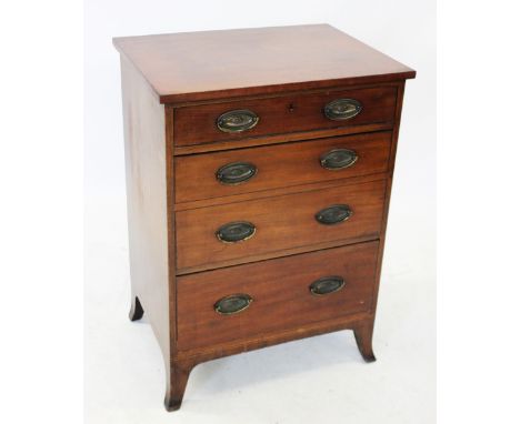 A 19th century mahogany chest of drawers, with an arrangement of three drawers, the deep middle drawer moulded as two drawers