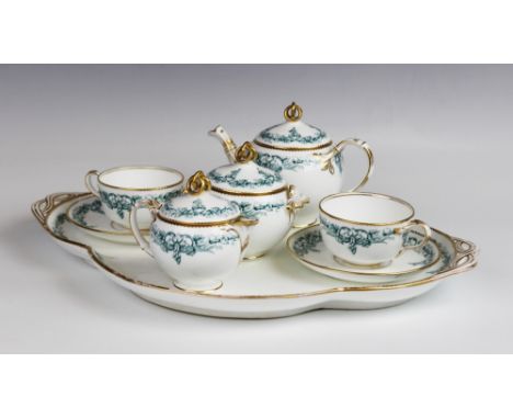 A porcelain cabaret set, early 20th century, each piece with green printed borders and gilt lined rims with entwined knop fin