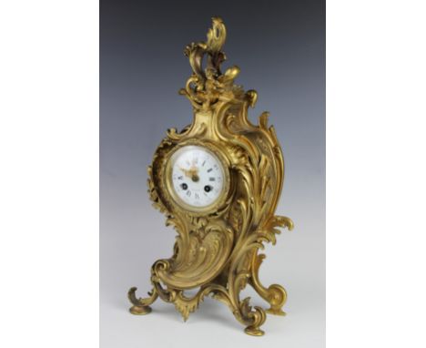 A late 19th century French gilt metal mantel clock, the 10cm white enamel dial with Arabic and Roman numerals, signed 'Bornan