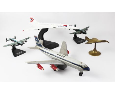 AVIATION INTEREST: A large vintage desk model of a British Airways Concorde on stand, 58.5cm long, with a small brass model o