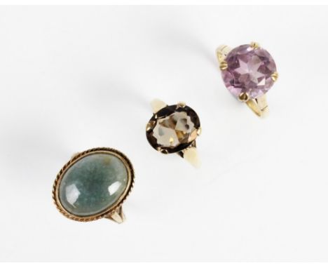 An amethyst set 9ct gold dress ring, the round mixed cut amethyst measuring 12mm diameter, ring size O, together with a 'smok